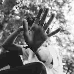 man holding up their hand