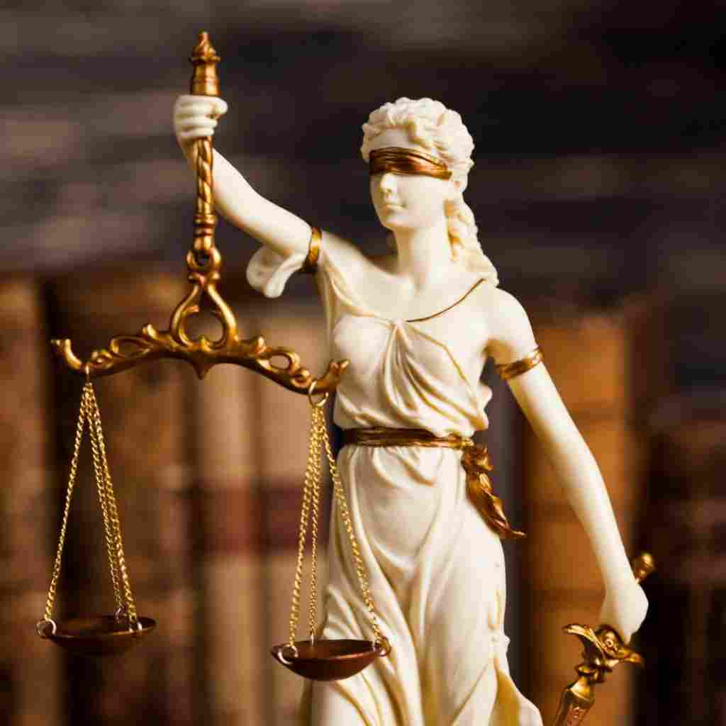 A gavel on a book of laws